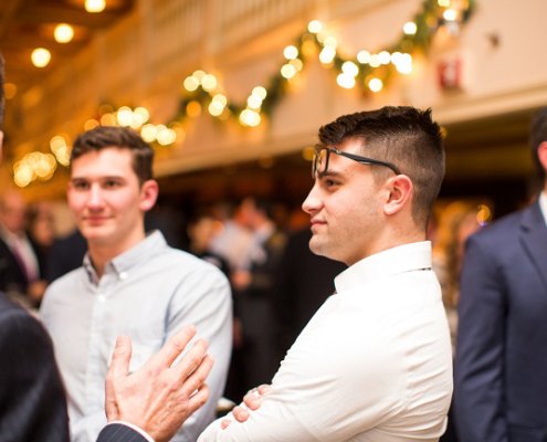 man in conversation with glasses on forehead